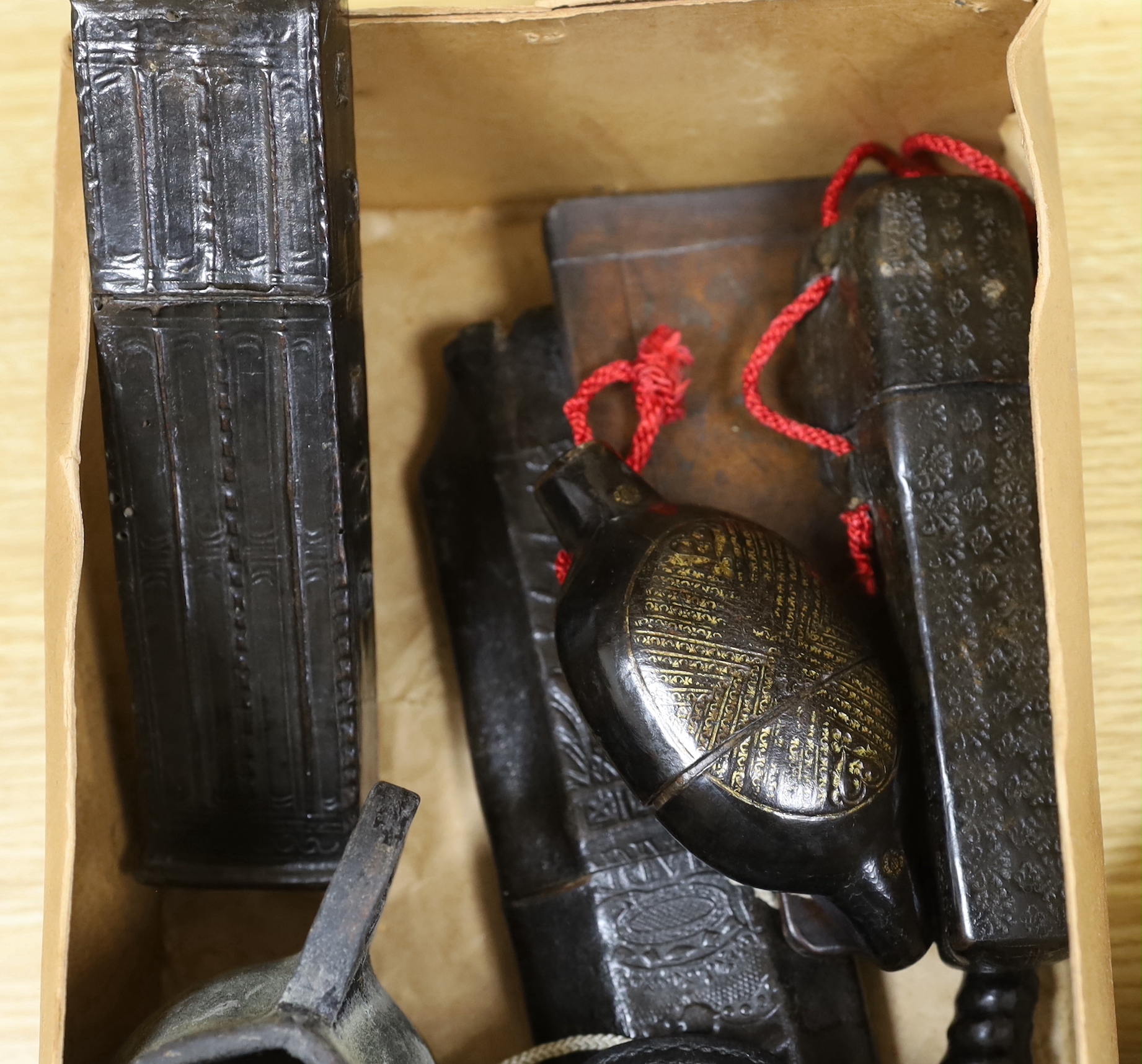 A quantity of stamped leather items including two flasks, two small tankards etc, largest flask 25cm high